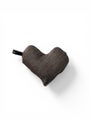 Small heart shaped warm pillow in brown color