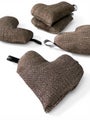 Small heart shaped warm pillow in brown