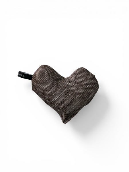 Small heart-shaped warming pillow in brown